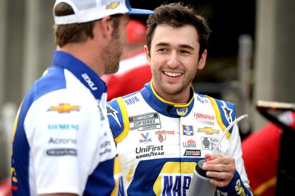 NASCAR Cup driver Chase Elliott, right, talks with his crew chief Alan Gustafson, left, following practice at Charlotte Motor Speedway on Friday, May 28, 2021. Elliott has been the sports most popular driver for three straight years and will be competing to win the Coca-Cola 600 on Sunday, May 30, 2021. Jeff Siner/jsiner@charlotteobserver.com