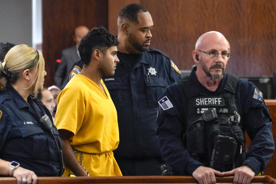 CORRECTS NAME: Johan Jose Martinez-Rangel is led into the courtroom on Tuesday, June 25, 2024 in Houston. Capital murder charges have been filed against Martinez-Rangel and Franklin Jose Pena Ramos, in the strangulation death of the 12-year-old. (Brett Coomer/Houston Chronicle via AP)