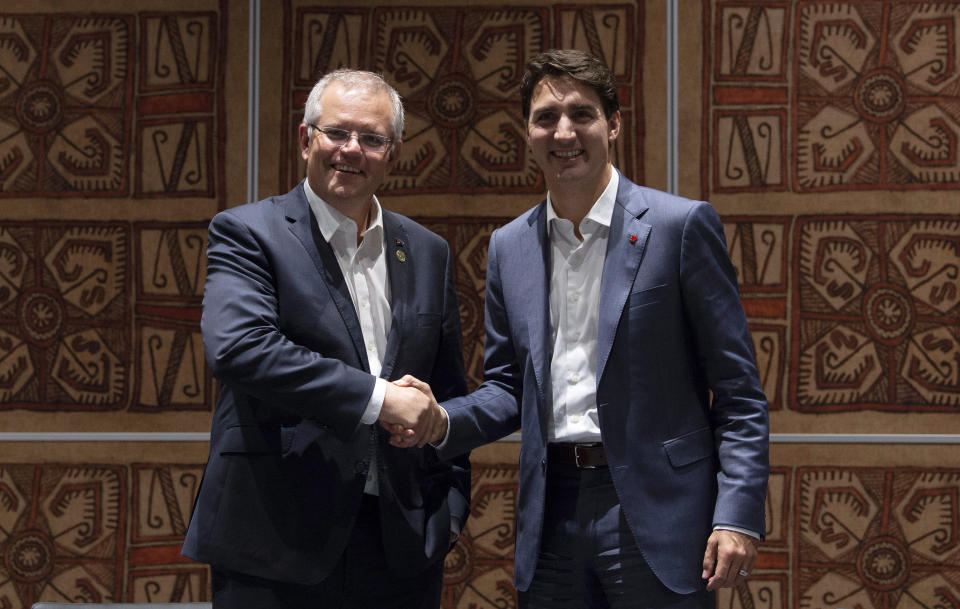 Canadian Prime Minister Justin Trudeau, right, speaks with Australian Prime Minister Scott Morrison during a bilateral meeting at the Asia-Pacific Economic Cooperation Summit in Port Moresby, Papua New Guinea, Sunday, Nov. 18, 2018. (Adrian Wyld/The Canadian Press via AP)