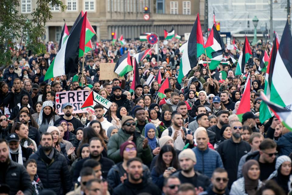 Participants marched to demonstrate in support of Palestinians in the Gaza Strip outside the Danish Parliament in Copenhagen, Denmark on Oct. 22. (Photo by Emil Helms/Ritzau Scanpix/AFP via Getty Images)