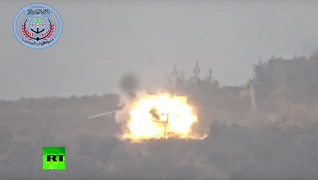 The helicopter is seen exploding as the missile hits.