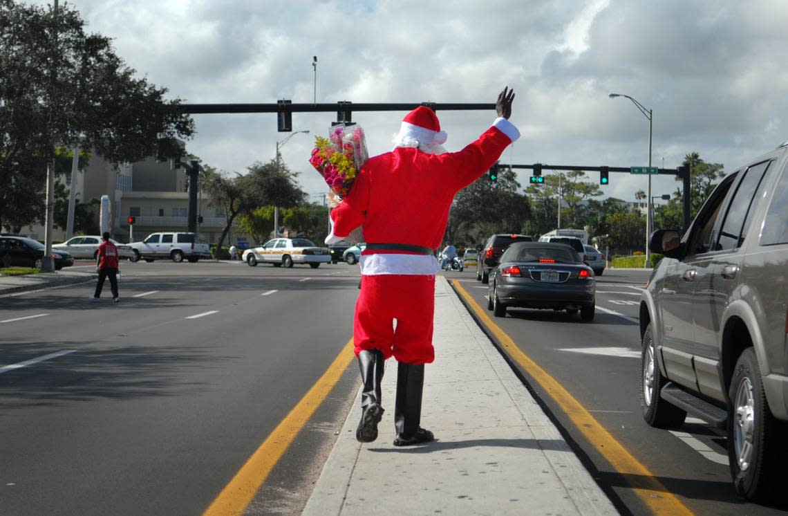 In 2006, Santa Claus sells flowers on 17st Street near U.S. 1 in Fort Lauderdale. on Christmas Eve in Fort Lauderdale.