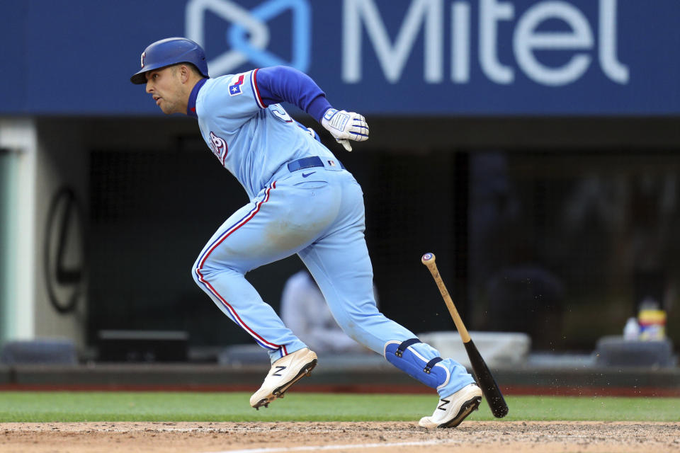 Texas Rangers' Nate Lowe (30) runs on a walkoff-single to score Eli White for the win over the Baltimore Orioles in the 10th inning during a baseball game on Sunday, April 18, 2021, in Dallas. (AP Photo/Richard W. Rodriguez)