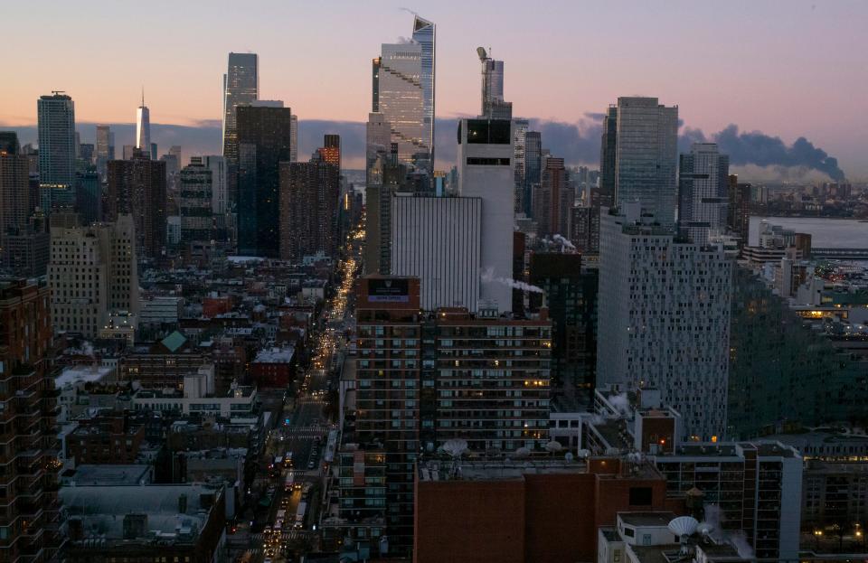 Smoke rises south of the New York borough of Manhattan as a warehouse burns in Elizabeth, N.J., spreading smoke over the southern skyline of New York Friday, Jan. 5, 2024. (AP Photo/Craig Ruttle) ORG XMIT: NYCR101