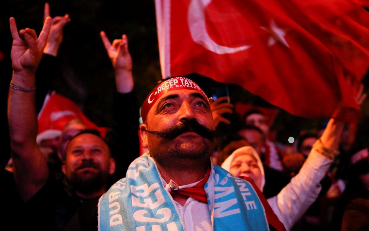 Supporters of Turkish president Tayyip Erdogan and AK Party (AKP) gather on election night in Istanbul - Dilara Senkaya/Reuters