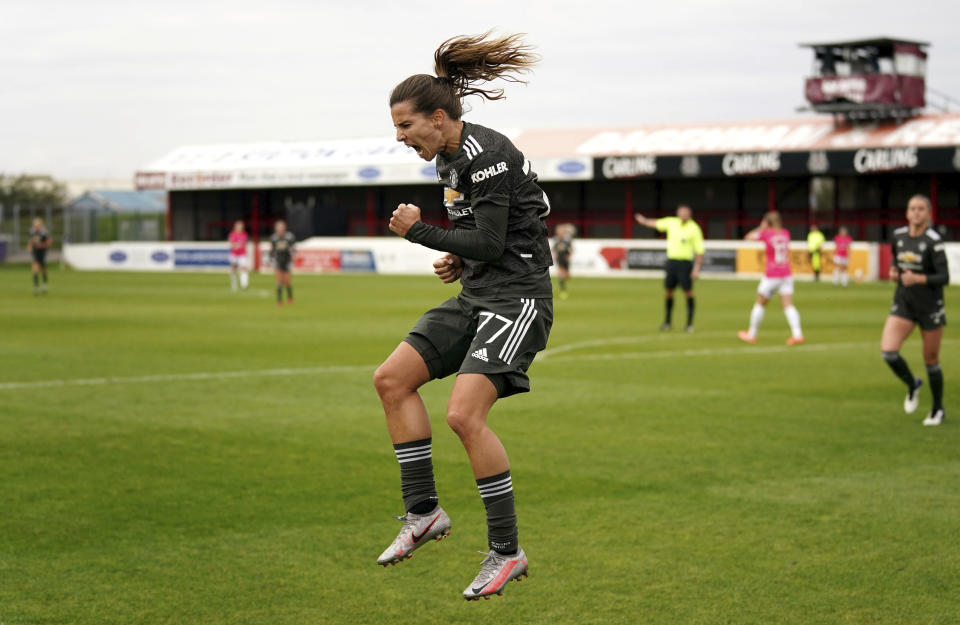 Manchester United's Tobin Heath celebrates scoring against West Ham United during the FA Women's Super League match at Victoria Road Stadium, London, Sunday Oct. 18, 2020. (John Walton/PA via AP)