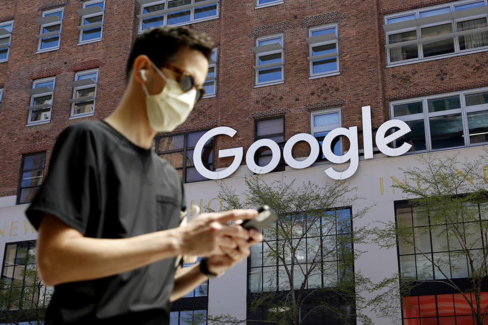 NEW YORK - NEW YORK - APRIL 13: A man checks his phone near a Google Corporate Office on April 13, 2021 in New York. More than 300 corporates including Google and Mc Donalds are pushing the Biden administration to almost double the United States target for cutting the planet warming emissions, ahead global summit on climate change in 2021. (Photo by John Smith/VIEWpress)