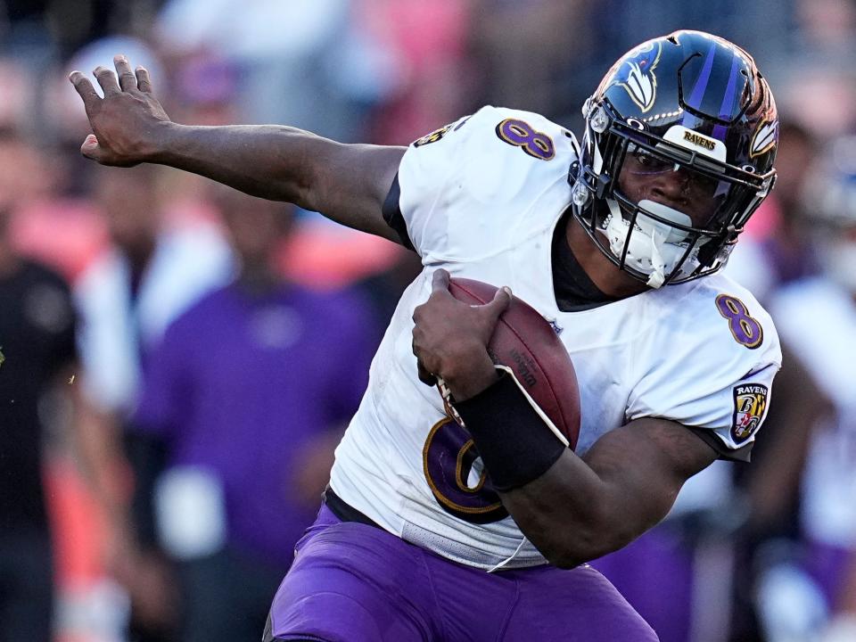 Lamar Jackson makes a run against the Denver Broncos.