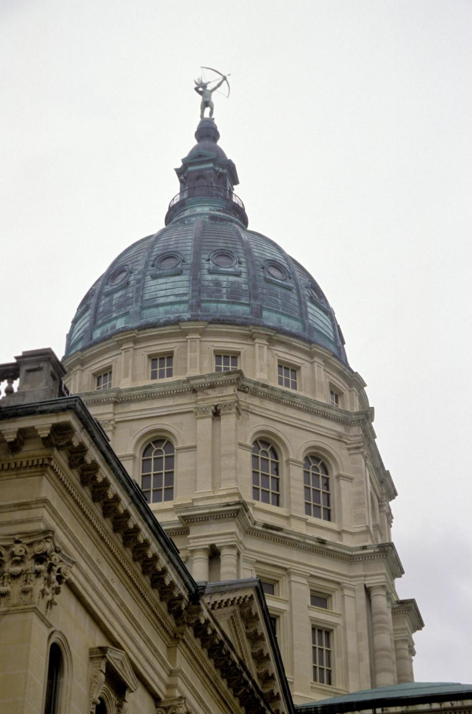 The Kansas State Capitol Building in Topeka comes with its very own Cupid-like archer at its reservoir tip. (OK, it's a Kansa Indian warrior, but go with us on this one.) 