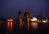 Indian soldiers stand guard near the site of explosion in Lethpora in south Kashmir's Pulwama district February 14, 2019. REUTERS/Danish Ismail