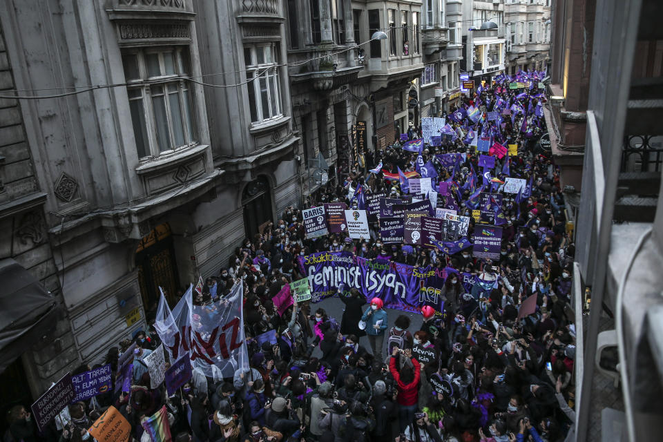 Protesters march to mark International Women's Day in Istanbul, Monday, March 8, 2021.Thousands of people joined the march to denounce violence against women in Turkey, where more than 400 women were killed last year. The demonstrators are demanding strong measures to stop attacks on women by former partners or family members as well as government commitment to a European treaty on combatting violence against women. (AP Photo/Emrah Gurel)