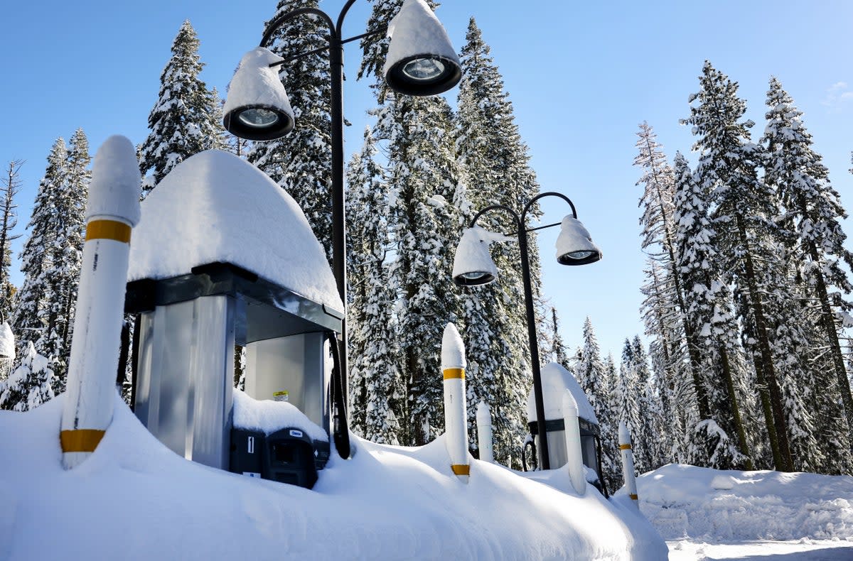 Gas pumps are partially buried in snow, at a service station closed for the winter, after a series of atmospheric river storms on January 20, 2023 in Yosemite National Park (Getty Images)