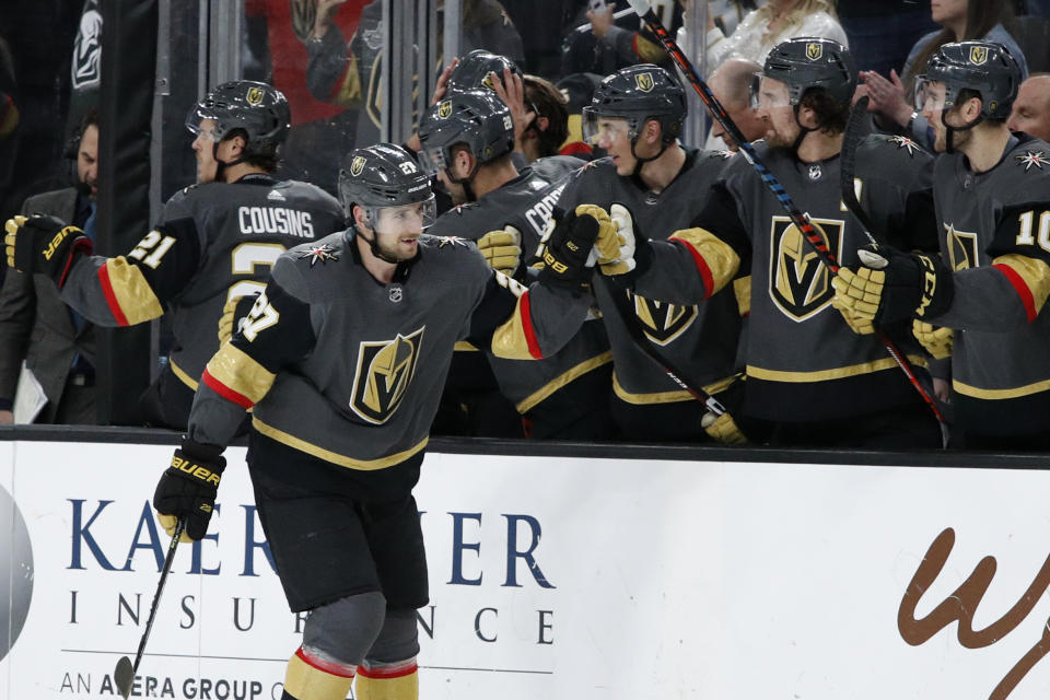 Vegas Golden Knights defenseman Shea Theodore (27) celebrates after scoring against the Edmonton Oilers during the third period of an NHL hockey game Wednesday, Feb. 26, 2020, in Las Vegas. (AP Photo/John Locher)