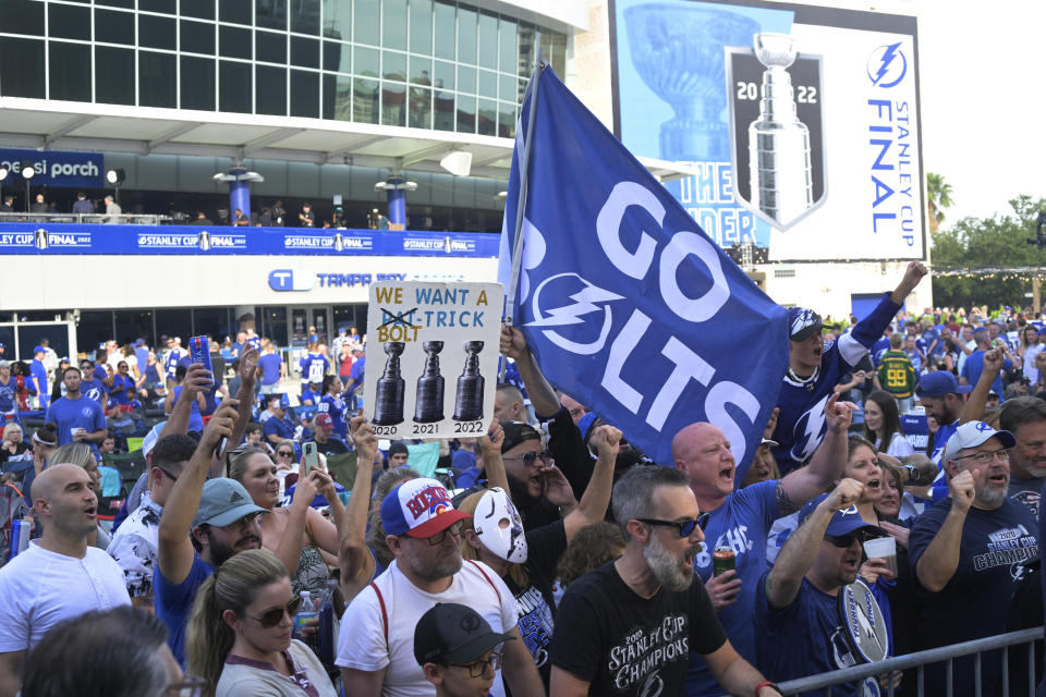 Tampa Bay Lightning hockey fans gather outside Amalie Arena before Game 4 of the NHL hockey Stanley Cup Finals against the Colorado Avalanche on Wednesday, June 22, 2022, in Tampa, Fla. (AP Photo/Phelan Ebenhack)