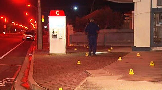 Police inspect the scene of the attack at Glengowrie, early this morning.