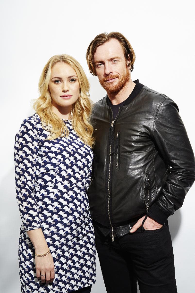 This Oct. 15, 2013 photo shows Toby Stephens, right, and Hannah New, from the new Starz original series, "Black Sails," in New York. The series premieres Saturday, Jan. 25. (Photo by Dan Hallman/Invision/AP)