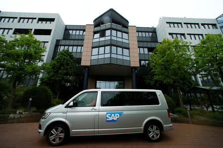 FILE PHOTO - A car with the logo of German software group SAP stands near its headquarters in Walldorf, Germany, May 12, 2016. REUTERS/Ralph Orlowski/File Photo