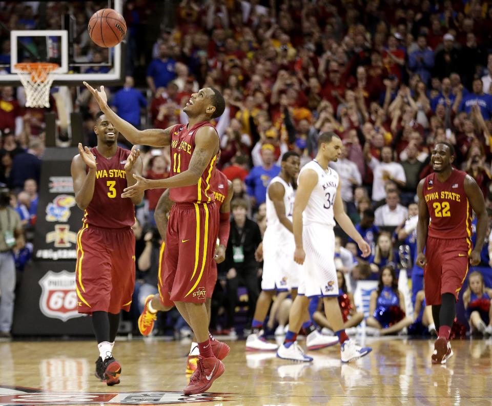 Iowa State players Monte Morris (11) and Melvin Ejim (3) celebrate after their upset over Kansas in an NCAA college basketball game in the semifinals of the Big 12 Conference tournament on Friday, March 14, 2014, in Kansas City, Mo. Iowa State won the game 94-83. (AP Photo/Charlie Riedel)