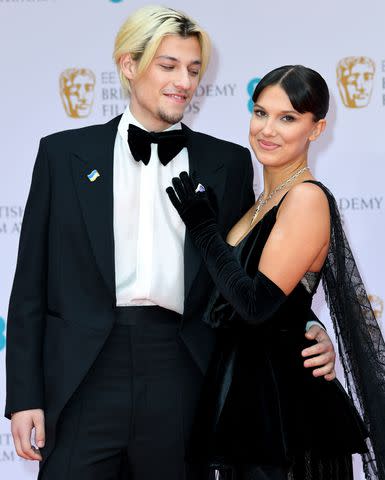 <p>Joe Maher/Getty</p> Jake Bongiovi and Millie Bobby Brown attend the EE British Academy Film Awards 2022 at Royal Albert Hall on March 13, 2022 in London, England