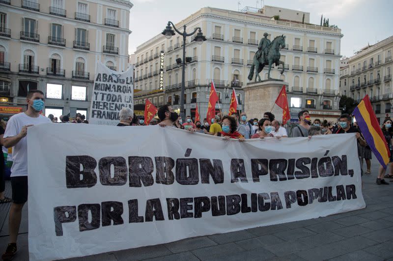 Protesters hold a banner during a protest against Spain's monarchy for the first time since former Spanish King Juan Carlos left the country amid an investigation into his involvement in a high-speed rail contract in Saudi Arabia, in Madrid