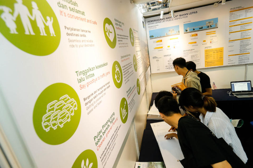 People peruse the Bayan Lepas Light Railway Transit (LRT) display and information booth at Komtar in George Town August 20, 2019. — Picture by Sayuti Zainudin