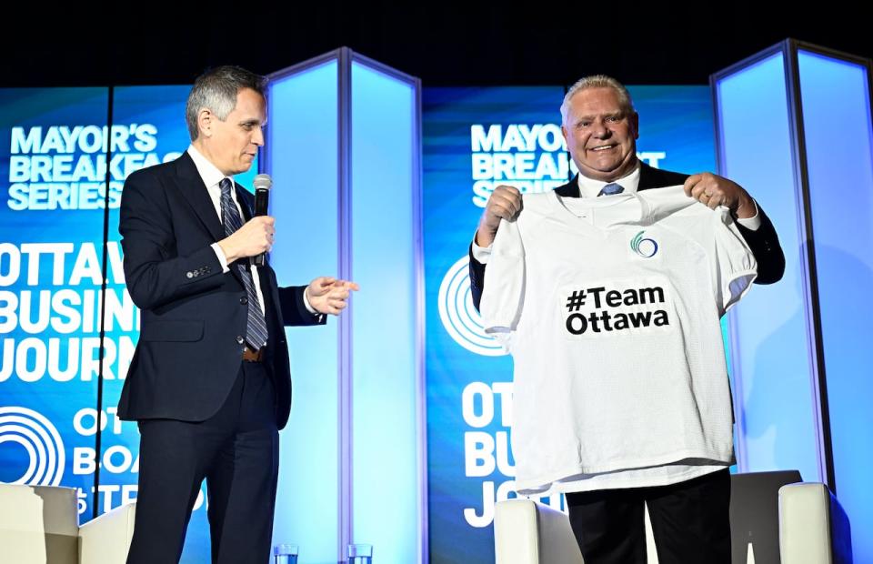Ontario Premier Doug Ford shows off a customized shirt from Ottawa Mayor Mark Sutcliffe in Ottawa on March 28, 2024.