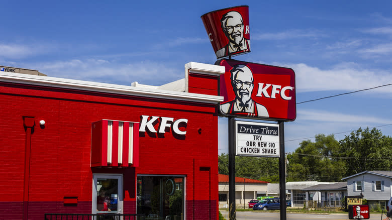 A KFC storefront with a blue sky