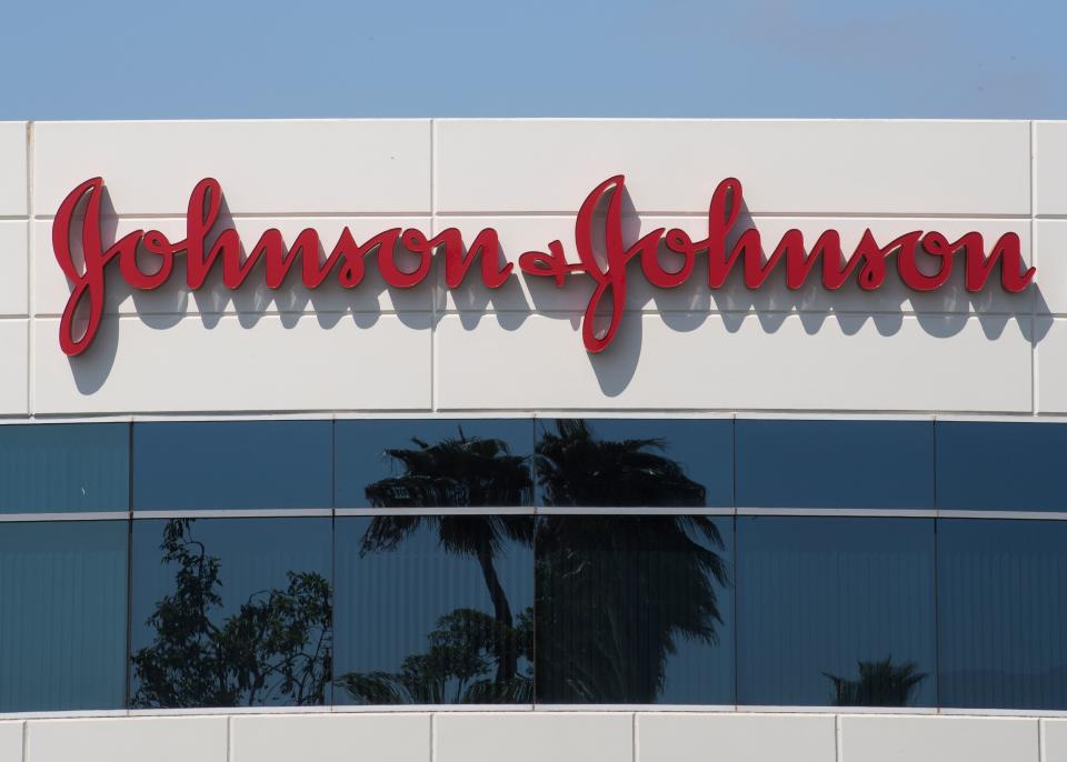 A sign on a building at the Johnson & Johnson campus shows their logo in Irvine, California on August 28, 2019. - The US pharmaceutical industry faces tens of billions of dollars in potential damage payments for fueling the opioid addiction crisis after Oklahoma won a $572 million judgment against drugmaker Johnson & Johnson. (Photo by Mark RALSTON / AFP)        (Photo credit should read MARK RALSTON/AFP/Getty Images)