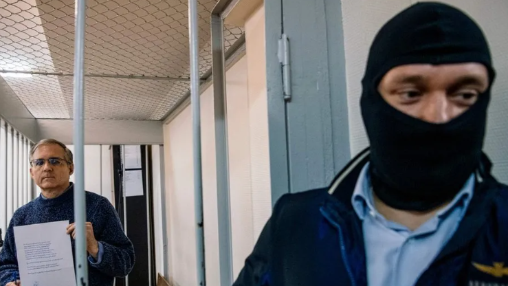 Whelan was guarded in the defendants' cage by a balaclava-clad FSB officer during a court hearing