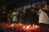 People attend candlelight vigil for victims of the crash of a state-run Pakistan International Airlines plane on Friday, in Karachi, Pakistan, Wednesday , May 27, 2020. (AP Photo/Fareed Khan)