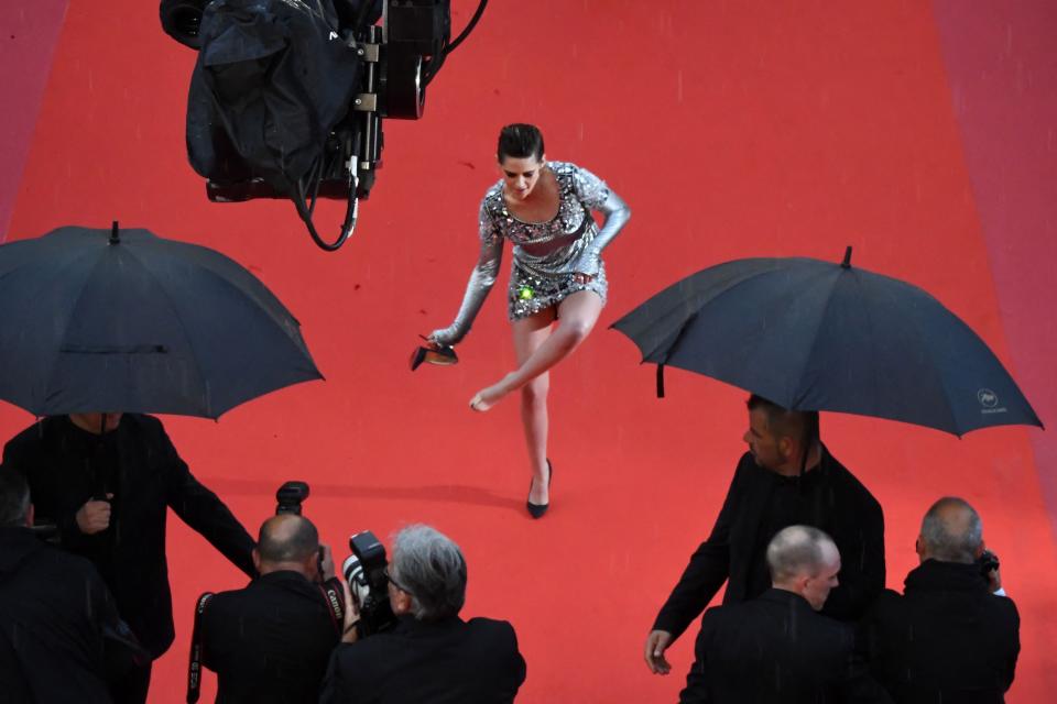 Kristen Stewart removes her Louboutins at the 2018 Cannes Film Festival premiere of Blackkklansman.