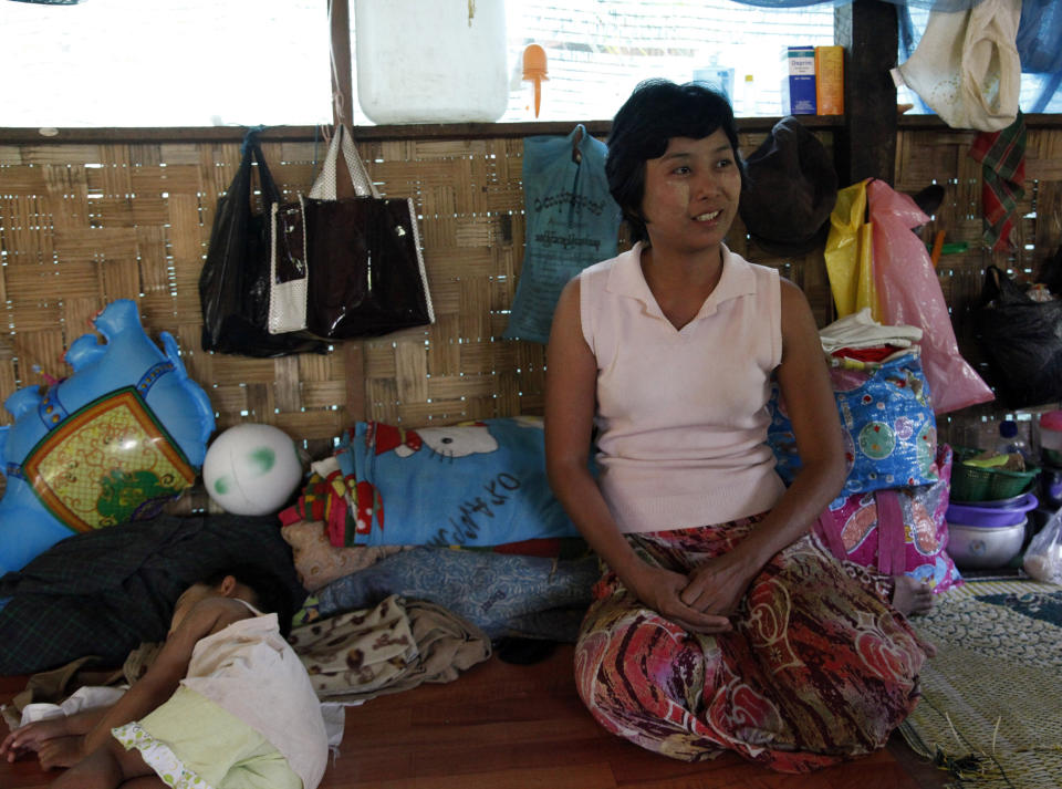 AIDS patient Ei Ei Phyo, right, talks during an interview while her child takes a rest at HIV/AIDS care center founded by Phyu Phyu Thin, a parliament member of Myanmar Opposition Leader Aung San Suu Kyi's National League for Democracy party, in outskirts of Yangon, Myanmar, Saturday, Mar. 1, 2014. Doctors Without Borders said Friday it has been expelled from Myanmar and that tens of thousands of lives are at risk. The government defended the move Friday, accusing the organization of creating tensions and instability in violence-scarred Rakhine state, where it has faced repeated protests for treating members of the long-persecuted Rohingya Muslim minority. (AP Photo/Khin Maung Win)