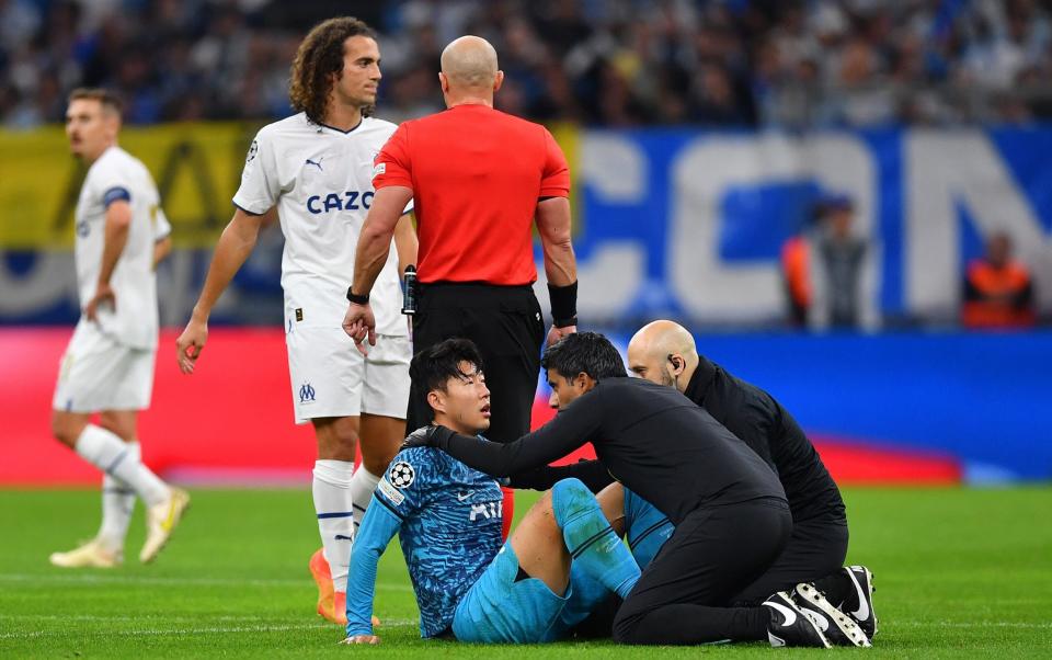  Son Heung-Min of Tottenham Hotspur goes down with an injury during the UEFA Champions League - South Korea World Cup 2022 squad list, fixtures and latest odds - Valerio Pennicino /Getty Images