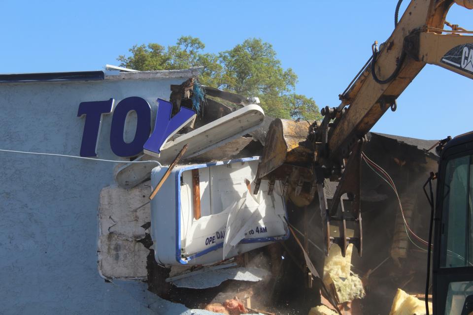 The Toy Box is ripped apart to make way for an office building near the eastern base of the Hathaway Bridge.