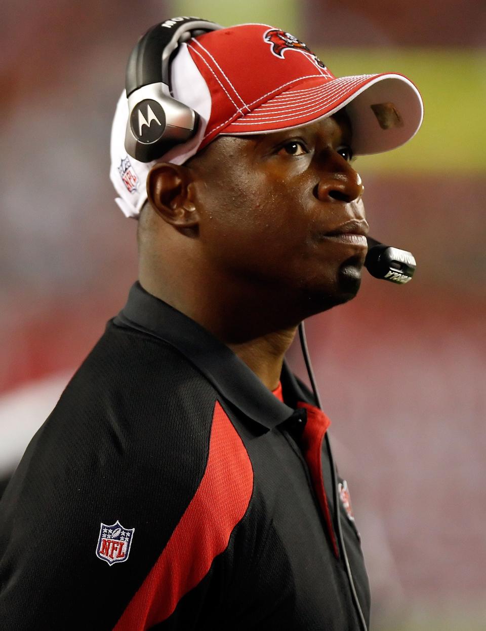 TAMPA, FL - DECEMBER 17:  Head coach Raheem Morris of the Tampa Bay Buccaneers looks at the scoreboard during the game against the Dallas Cowboys at Raymond James Stadium on December 17, 2011 in Tampa, Florida.  (Photo by J. Meric/Getty Images)