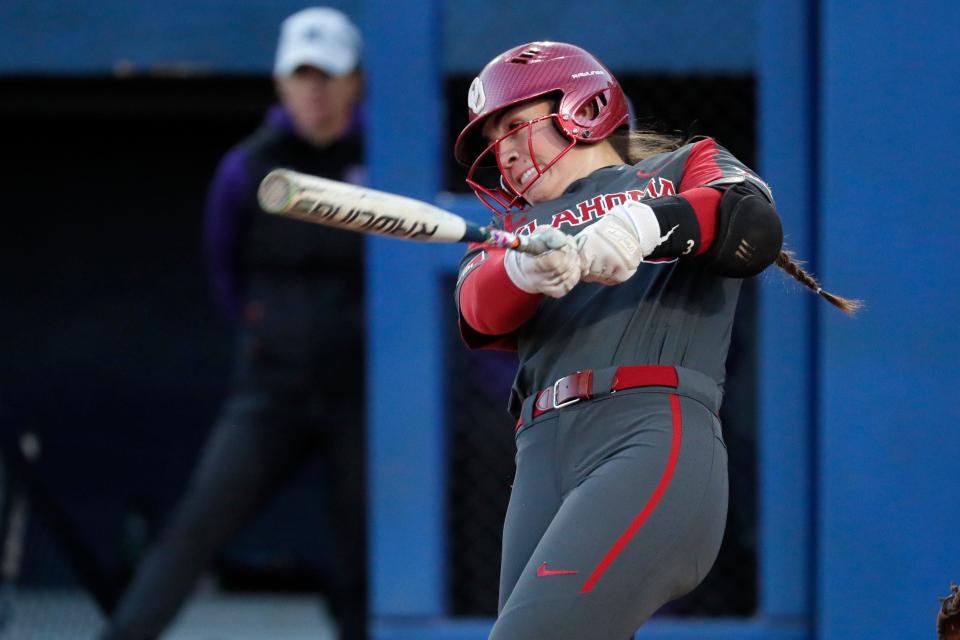 Oklahoma's Grace Lyons hits a home run in the second inning of a college softball game between the University of Oklahoma Sooners (OU) and the Northwestern Wildcats at USA Softball Hall of Fame Stadium in Oklahoma City, Friday, March 17, 2023. Oklahoma won 2-1. 