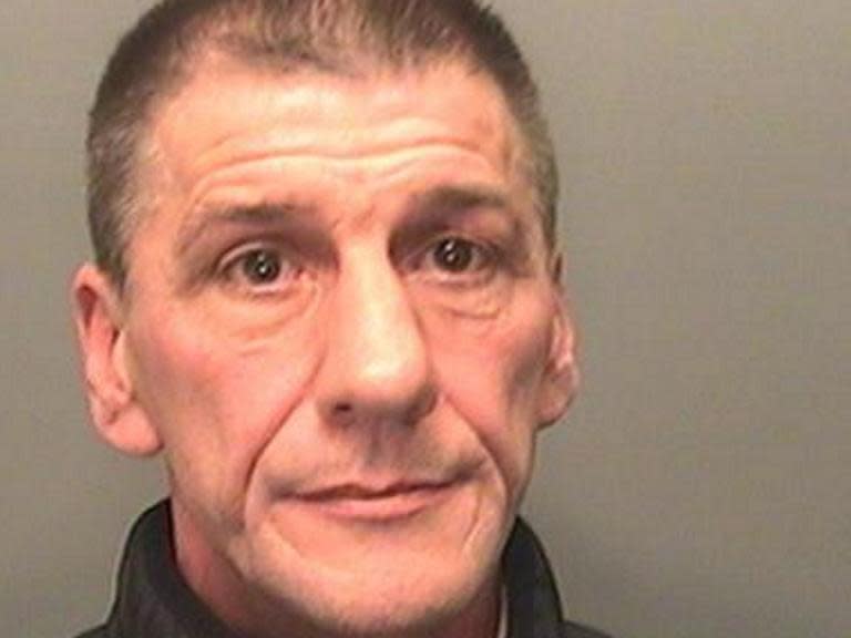 Paedophile found hiding behind false wall in flat after five years on run from police