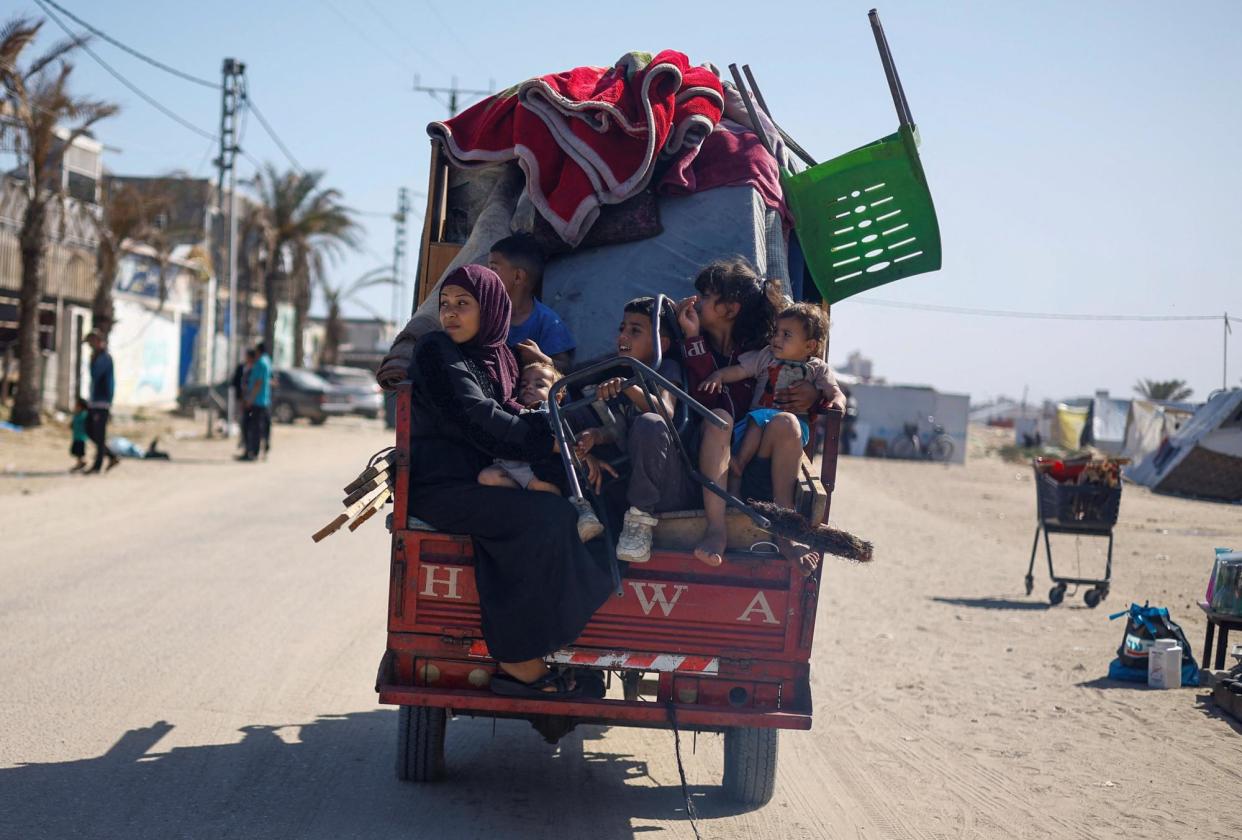 <span>Palestinians flee Rafah after Israeli forces launched a ground and air operation in the eastern part of the city.</span><span>Photograph: Mohammed Salem/Reuters</span>