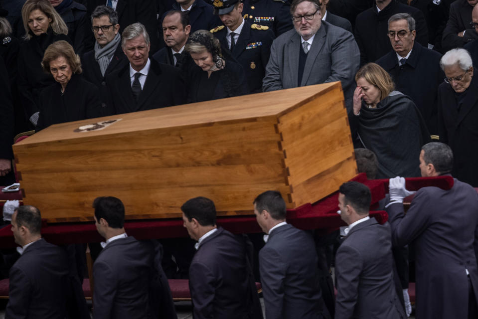 Pallbearers carry away the coffin of the late Pope Emeritus Benedict XVI after the public funeral Mass for Pope Emeritus Benedict XVI in St. Peter’s Square on Jan. 5, 2023. In the front row are (from left) Sofia, former Queen of Spain, King Philippe of Belgium, Queen Mathilde of Belgium, Giorgia Meloni (2nd from right), Prime Minister of Italy, Sergio Mattarella (right), President of Italy.<span class="copyright">Oliver Weiken—dpa/picture alliance/Getty Images</span>
