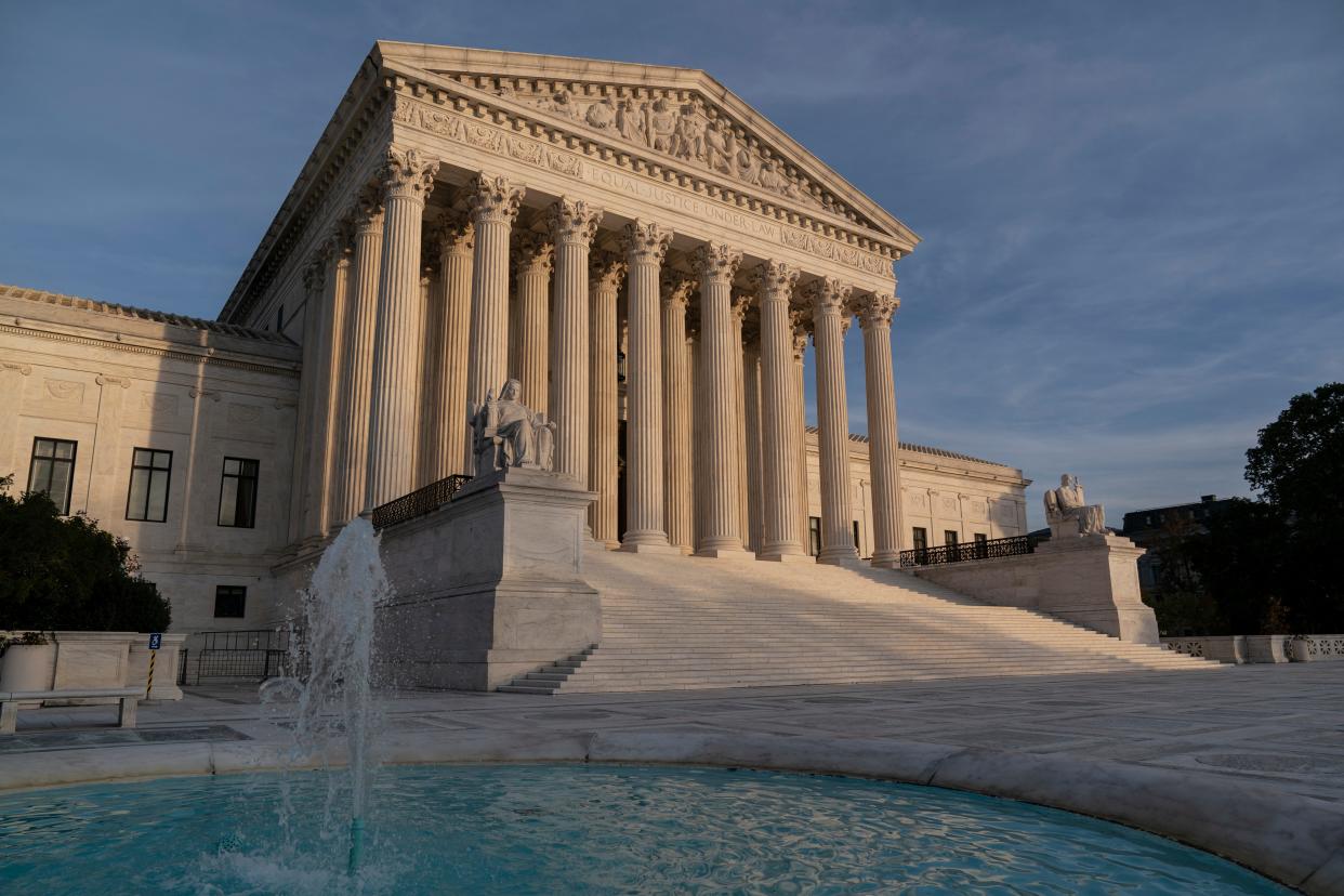 FILE - In this Nov. 5, 2020 file photo, the Supreme Court is seen in Washington.  The Supreme Court will take up challenges to controversial Trump administration policies affecting family-planning clinics and immigrants, even though the Biden administration has announced it is reviewing them. (AP Photo/J. Scott Applewhite) ORG XMIT: WX104