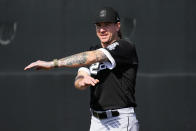 Chicago White Sox pitcher Mike Clevinger stretches during an MLB spring training baseball practice, Saturday, Feb. 18, 2023, in Phoenix. (AP Photo/Matt York)