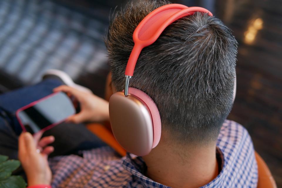 Guy wearing Apple AirPods Max over his head