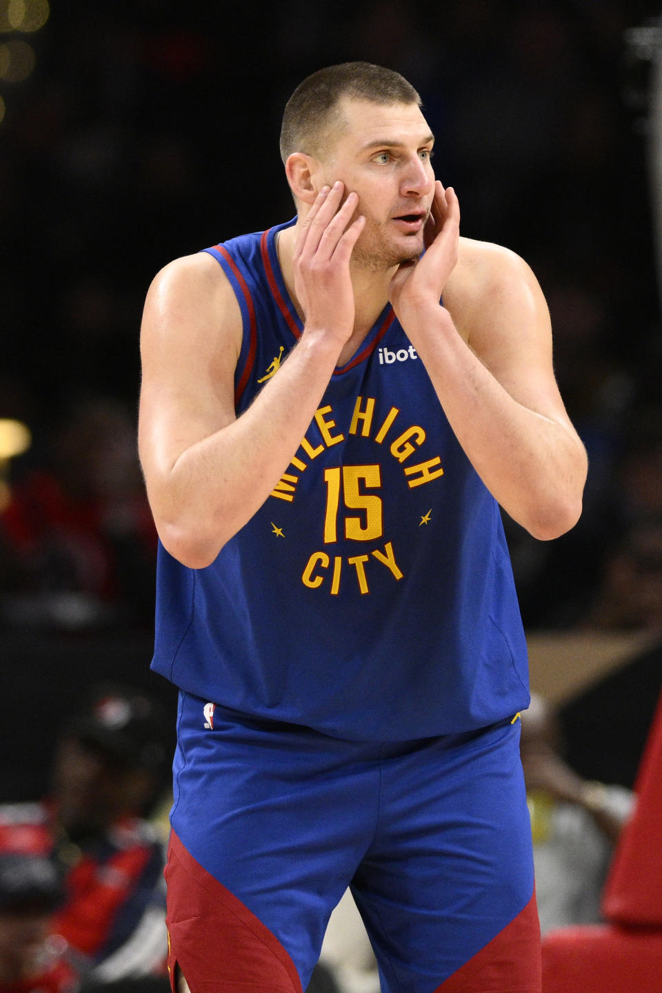 Denver Nuggets center Nikola Jokic reacts after he was called for a foul during the first half of an NBA basketball game against the Washington Wizards, Sunday, Jan. 21, 2024, in Washington. (AP Photo/Nick Wass)