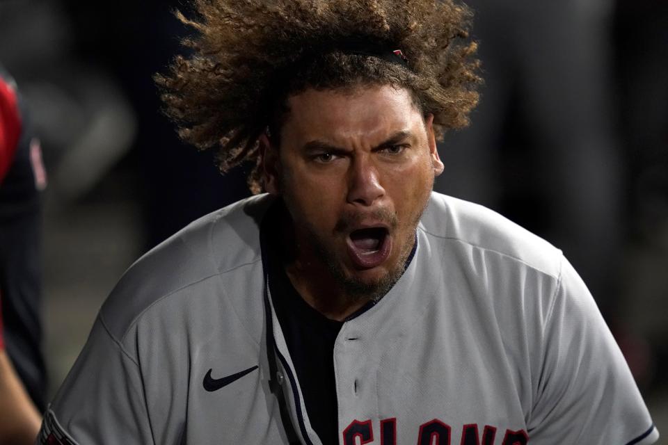 Guardians first baseman Josh Naylor screams in the dugout after hitting a three-run homer run in the 11th inning that led to a 12-9 win over the Chicago White Sox. [Charles Rex Arbogast/Associated Press]