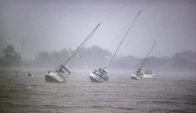 Sailboats anchored in Roberts Bay are blown around by 50 mph winds in Venice as Hurricane Ian approaches the western coast of Florida on Wednesday. (Photo: El Nuevo Herald via Getty Images)