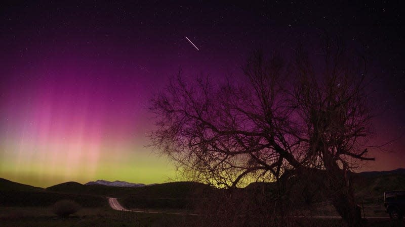Aurora over Utah, with the ISS, visible as a streak, in the background, May 13, 2024. - Image: NASA/Bill Dunford
