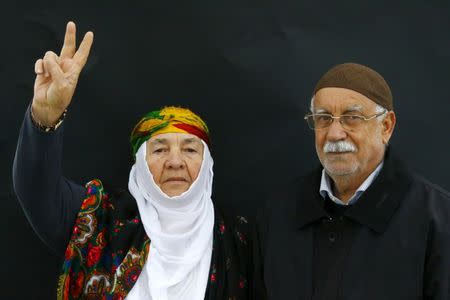 A Kurdish couple poses for a picture as they arrive for a gathering celebrating Newroz in Diyarbakir March 21, 2015. REUTERS/Umit Bektas