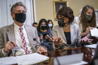 House Energy and Commerce Chairman Frank Pallone, D-N.J., left, and House Financial Services Committee Chairwoman Maxine Waters, D-Calif., go over their notes at the House Rules Committee as they prepare an emergency extension of the eviction moratorium, at the Capitol in Washington, Friday, July 30, 2021. President Joe Biden called on "Congress to extend the eviction moratorium to protect such vulnerable renters and their families without delay." (AP Photo/J. Scott Applewhite)