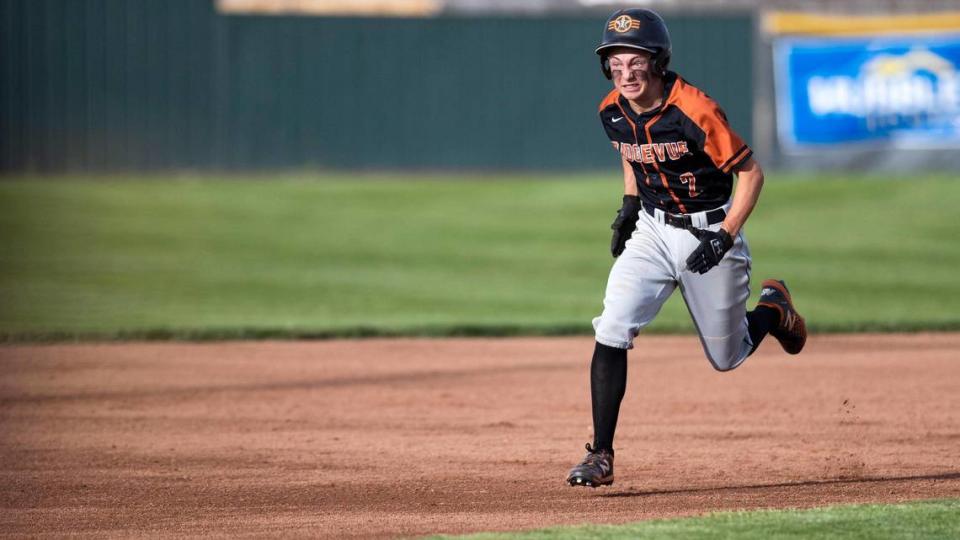 Ridgevue junior catcher Colton Bowman sprints to third base to complete a two-run triple as part of the Warhawks’ five-run first inning Thursday.