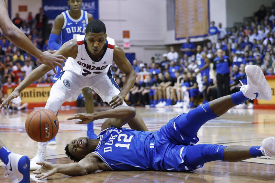 Duke forward Javin DeLaurier (12) loses the ball while being guarded by Gonzaga guard Zach Norvell Jr. (23) during the first half of an NCAA college basketball game at the Maui Invitational, Wednesday, Nov. 21, 2018, in Lahaina, Hawaii. (AP Photo/Marco Garcia)